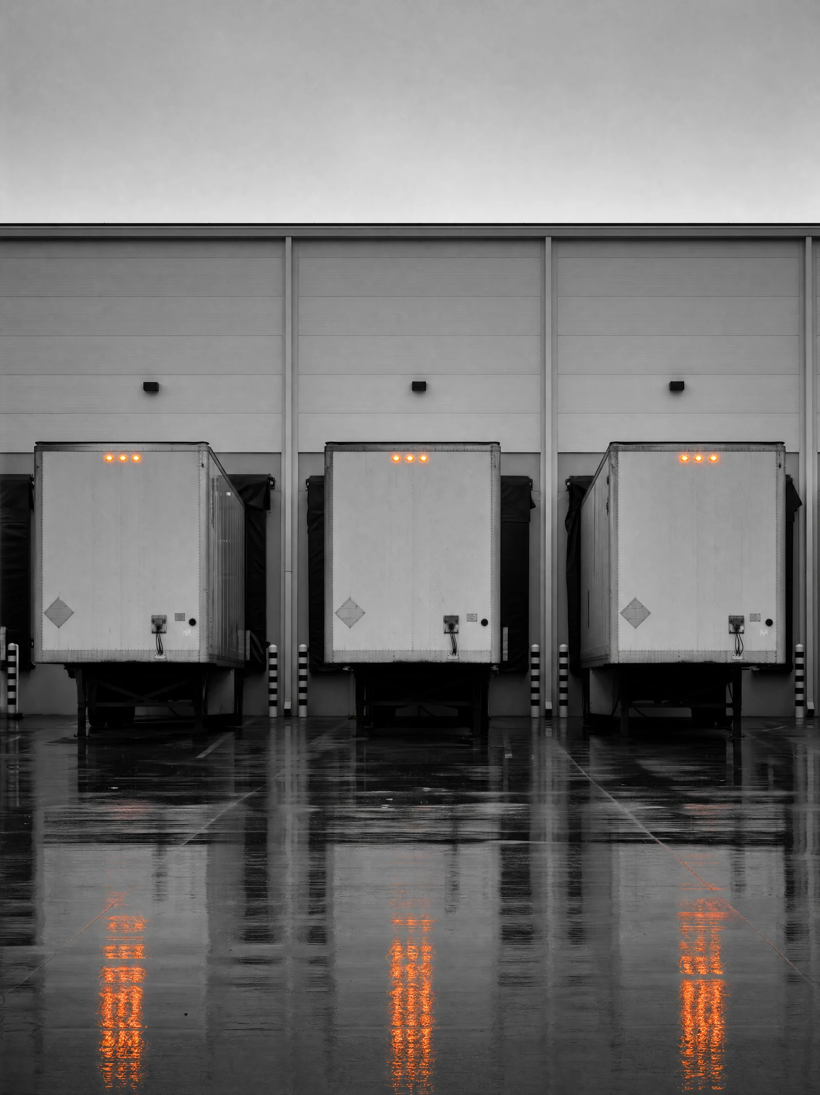 Forklift staging a shrink-wrapped pallet at a loading dock for a partial truckload