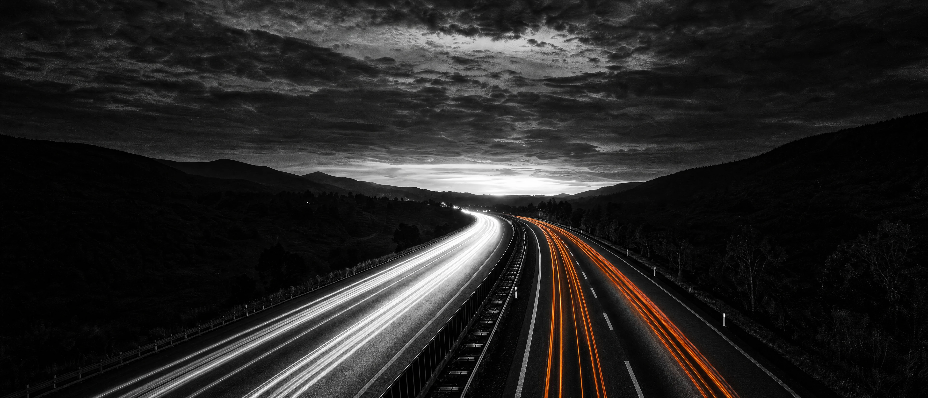 DSB Logistics Group semi truck on a night interstate with orange taillight trails