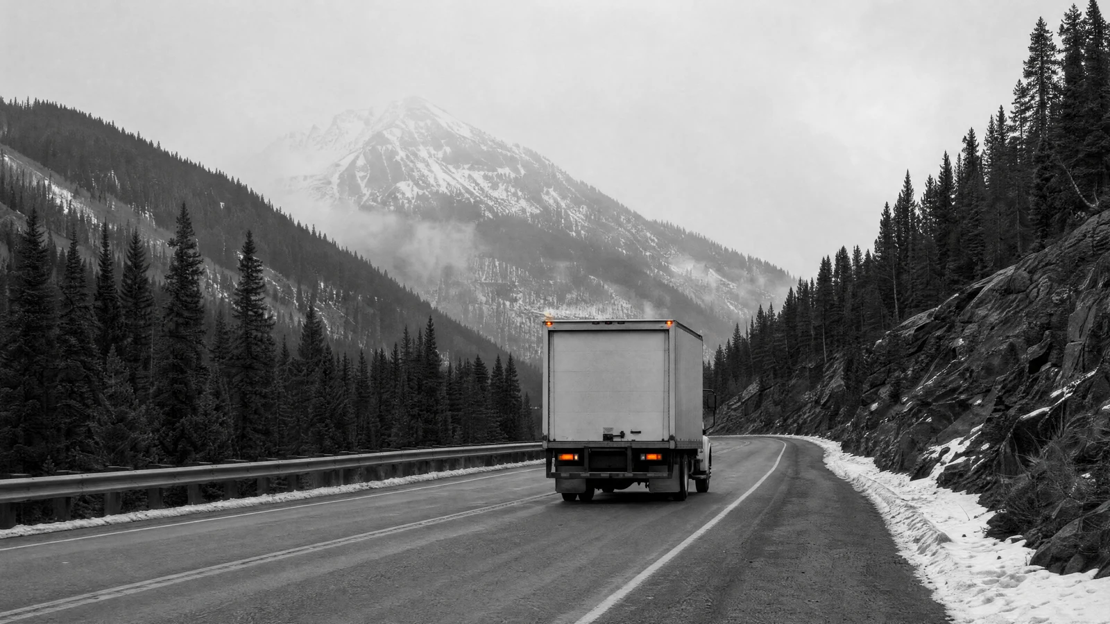 DSB truck on a scheduled route through a mountain valley