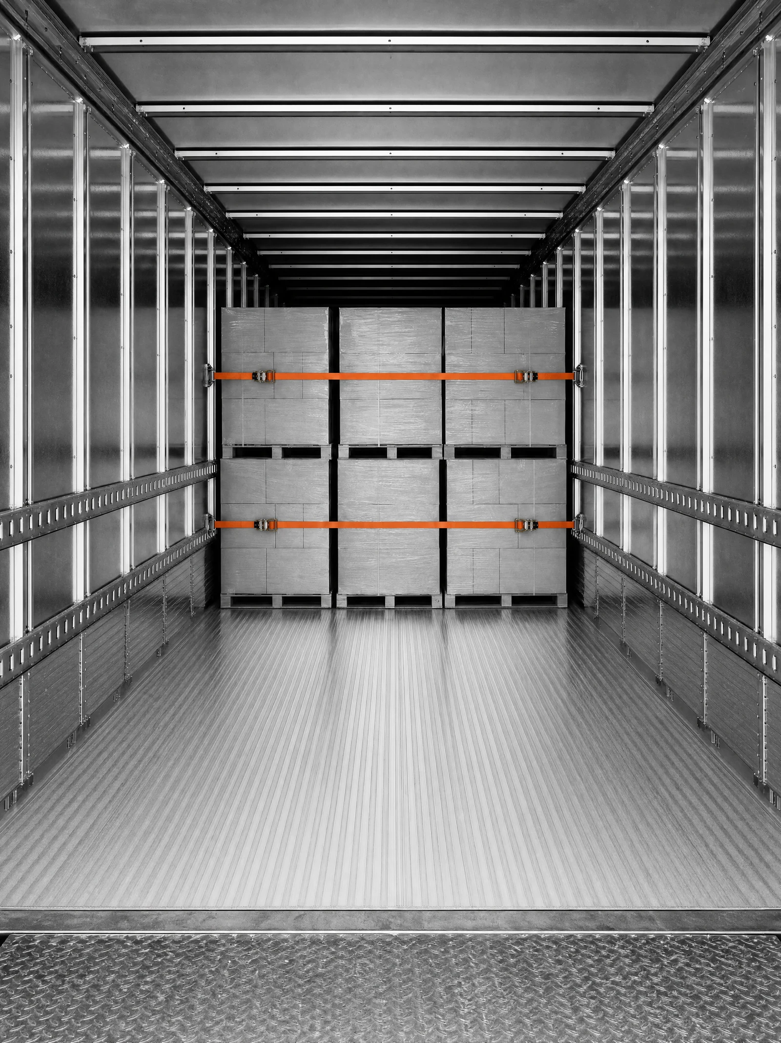 Shrink-wrapped LTL pallets strapped inside a DSB trailer